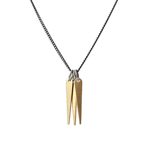 A trio of decorative brass spikes, dangling from a gunmetal and steel chain, and finished with a hand-formed, sterling silver clasp and closure. Hand-crafted in Portland, Oregon. 