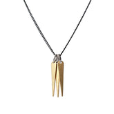 A trio of decorative brass spikes, dangling from a gunmetal and steel chain, and finished with a hand-formed, sterling silver clasp and closure. Hand-crafted in Portland, Oregon. 