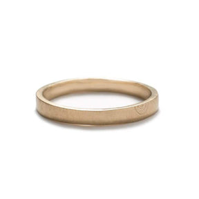 Thin, flat, 14k yellow gold band with a matte finish and a minimalistic, hand-carved, semi-circle design that is reminiscent of a rainbow. Hand-crafted in Portland, Oregon.