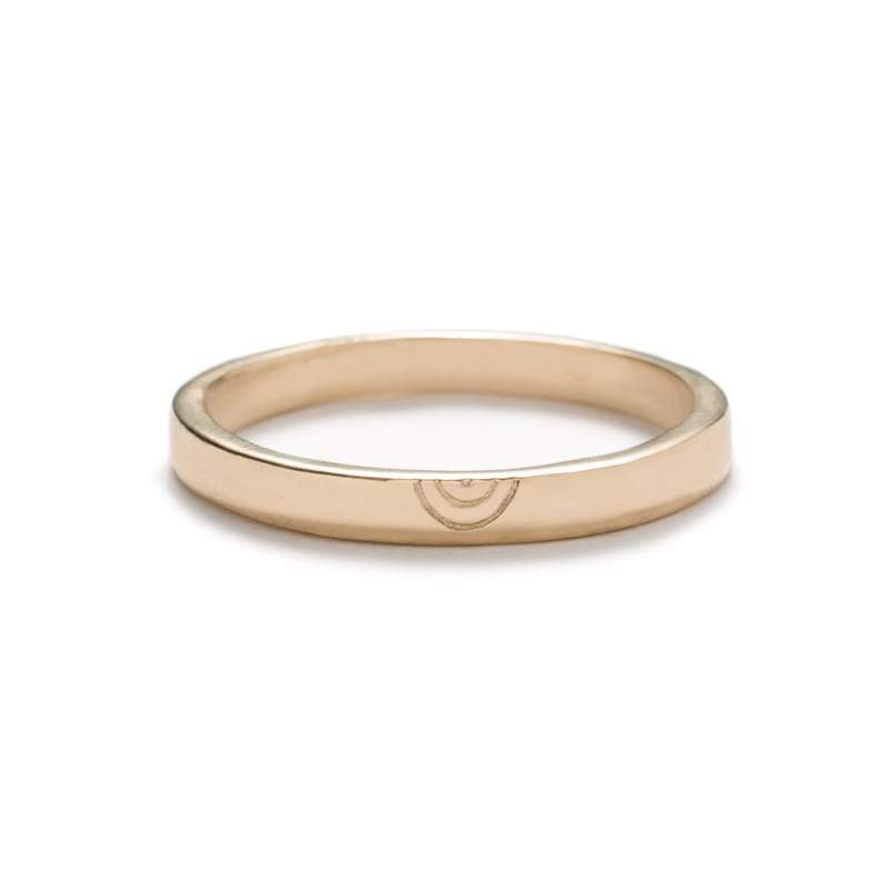 Thin, flat, 14k yellow gold band with a polished finish and a minimalistic, hand-carved, semi-circle design that is reminiscent of a rainbow. Hand-crafted in Portland, Oregon.