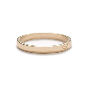 Thin, flat, 14k yellow gold band with a polished finish and a minimalistic, hand-carved, semi-circle design that is reminiscent of a rainbow. Hand-crafted in Portland, Oregon.