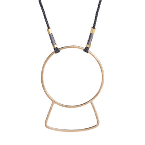 Long necklace of gray, hand-spun Japanese cotton thread, featuring a large, geometric, yellow bronze focal piece, brass tubing, and small copper wire accents. Hand-crafted in Portland, Oregon.
