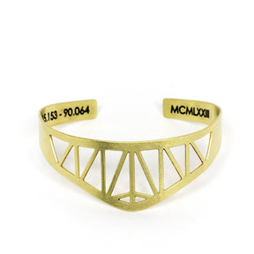 Modern, delicate, and adjustable brass cuff bracelet modeled after the Hernando de Soto Bridge in Memphis, Tennessee, with the bridge's georgraphical coordinates and date of construction engraved on the inner cuff.  Hand-crafted in Portland, Oregon.