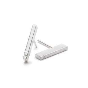 Slim, rectangular sterling silver bars with a notch detail at one end, soldered to sterling silver earring posts. Hand-crafted in Portland, Oregon. 