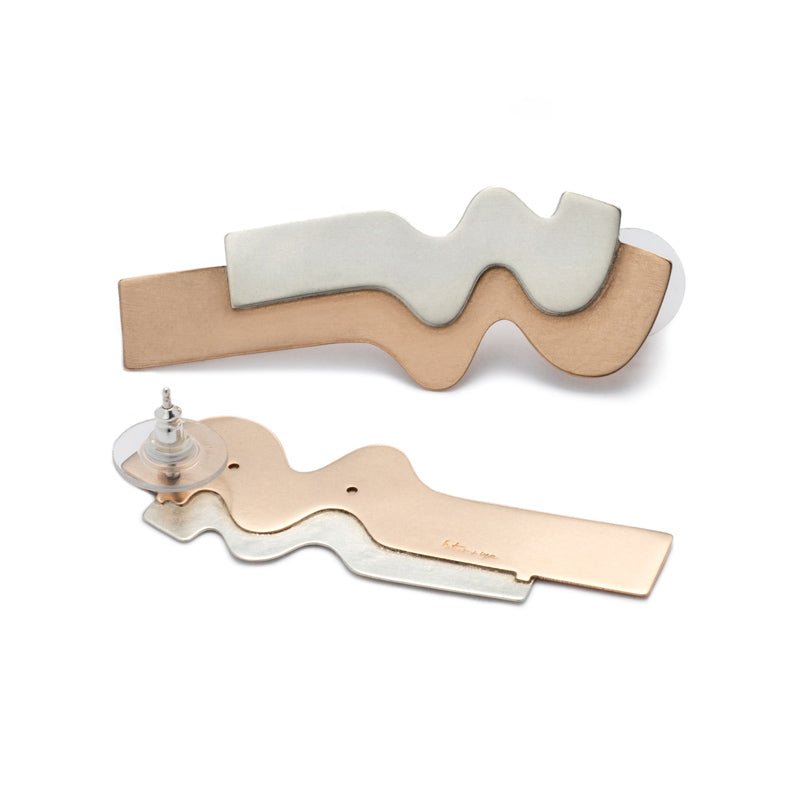 Sleek stud earrings with long curves of flat, layered bronze and silver, with sterling silver earring posts and sterling silver and plastic comfort-clutch backings. Hand-crafted in Portland, Oregon.