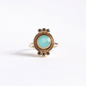 top of round Peruvian opal 10k gold ring with six black diamonds.