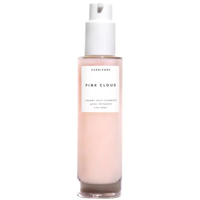 Glass bottle with pink cleanser inside. The label reads: "HERBIVORE PINK CLOUD CREAMY JELLY CLEANSER"