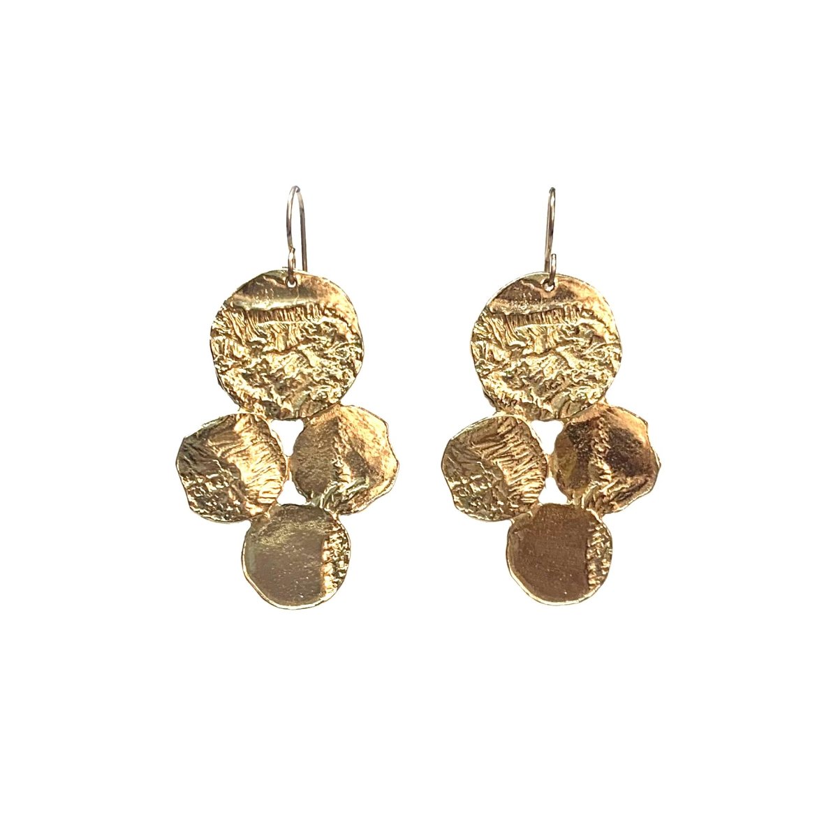 A pair of dangling brass earrings, with four coin-shape focal points. The brass is hammered slightly giving a nice texture. The Little Bit of Luck earrings are from designer Lingua Nigra.