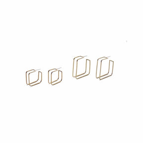 Set of small Square Caged Hoops on Left. Set of large Square Caged Hoops on Right. Made with brass and sterling silver posts. Designed and Handcrafted by Natalie Joy in Portland, Oregon.