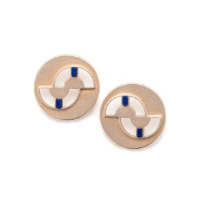 Circular, quarter-sized bronze studs with cutouts and four ethically sourced, fair trade lapis lazuli inlays per pair. Hand-crafted in Portland, Oregon.