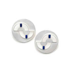 Circular, quarter-sized silver studs with cutouts and four ethically sourced, fair trade lapis lazuli inlays per pair. Hand-crafted in Portland, Oregon.