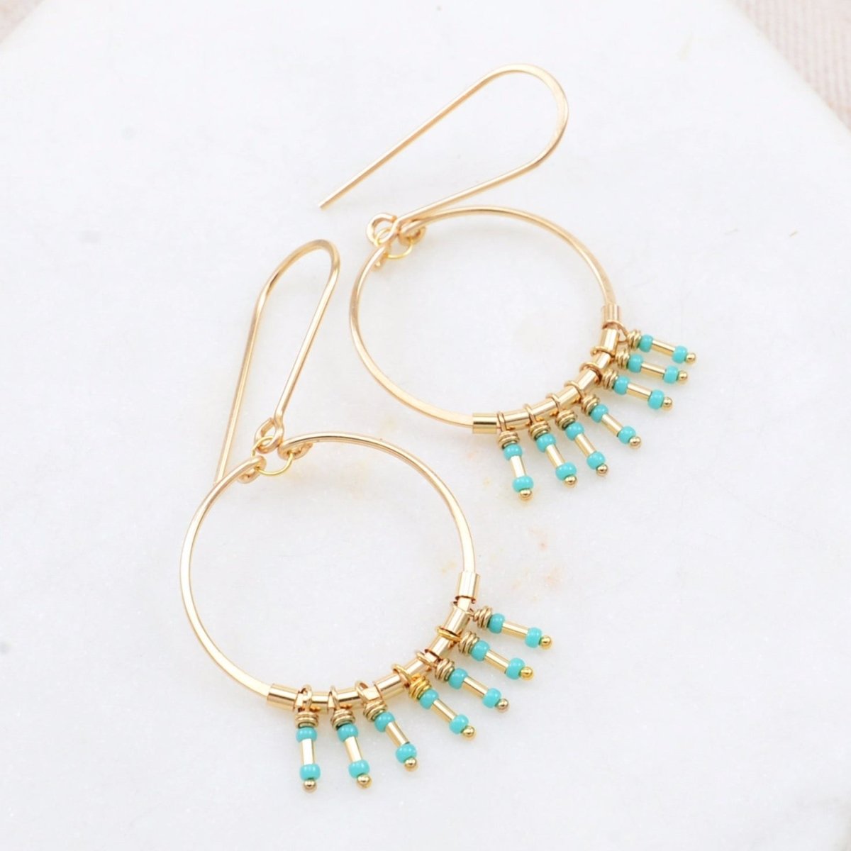 Gold-fill hoop earrings with turquoise and gold-fill fringe. The Clarice Earrings in Turquoise is designed and handmade by Amy Olson in Portland, Oregon.