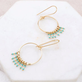Gold-fill hoop earrings with turquoise and gold-fill fringe. The Clarice Earrings in Turquoise is designed and handmade by Amy Olson in Portland, Oregon..