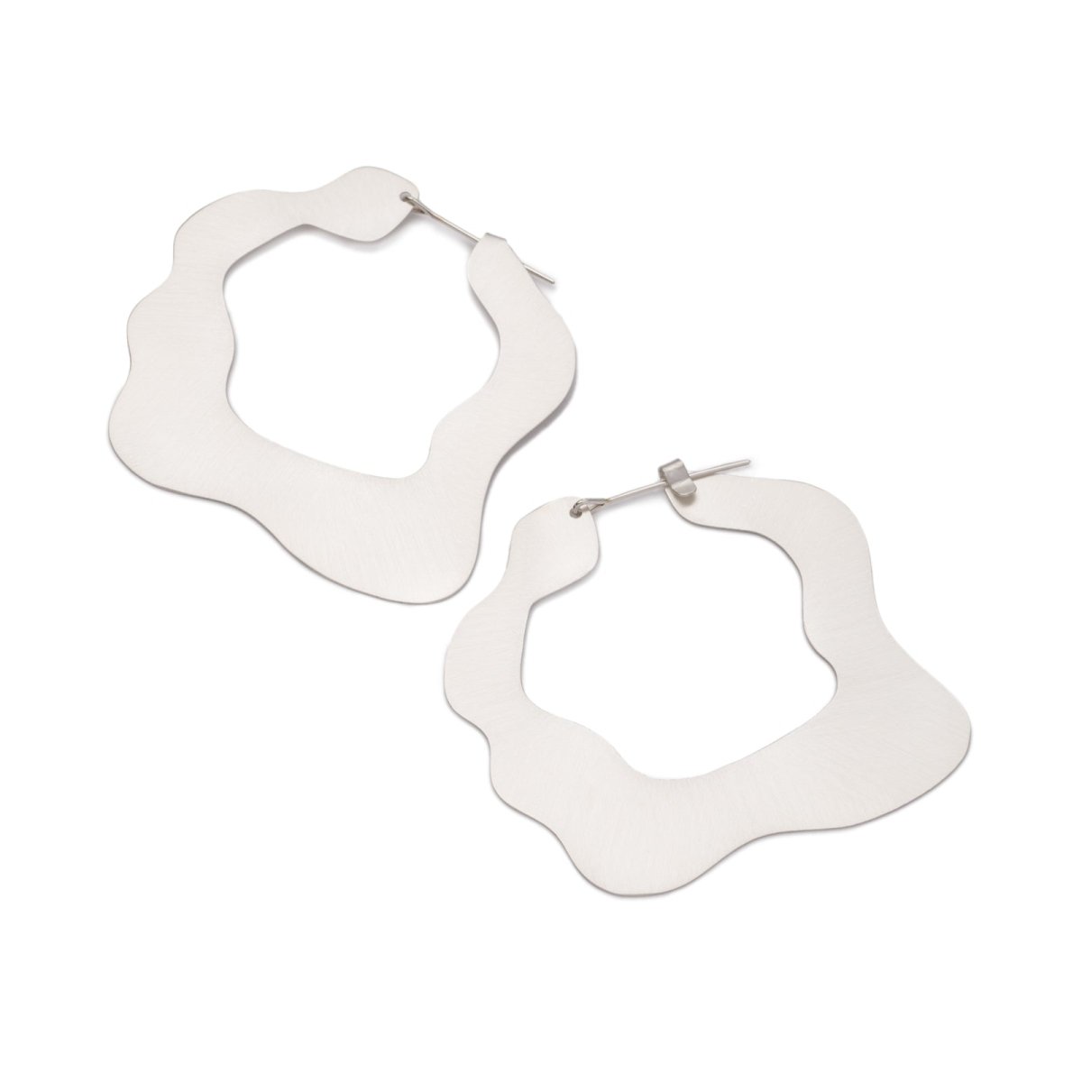 Large, glam, brushed sterling silver statement hoop earrings, featuring a flat profile and curvy edges, and completed with sterling silver-filled ear wires. Hand-crafted in Portland, Oregon. 