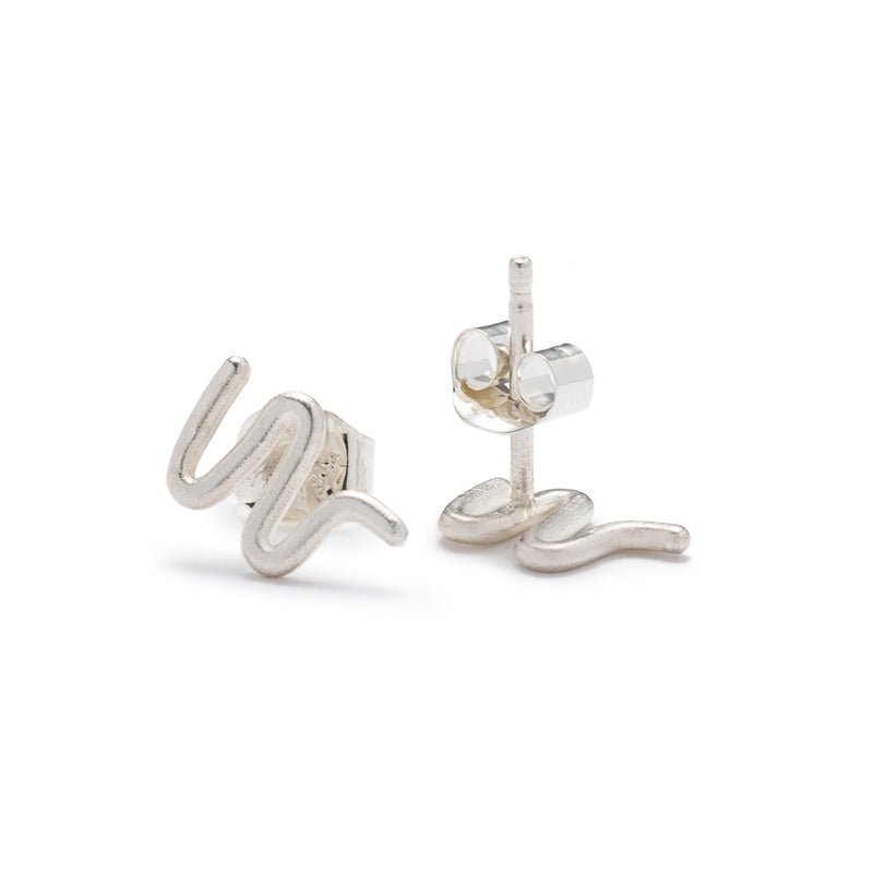 Tiny, silver, snake-inspired studs with sterling silver earring posts and ear nuts. Hand-crafted in Portland, Oregon.